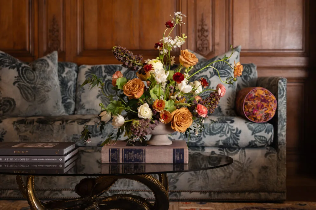 floral arrangement on a coffee table in home library