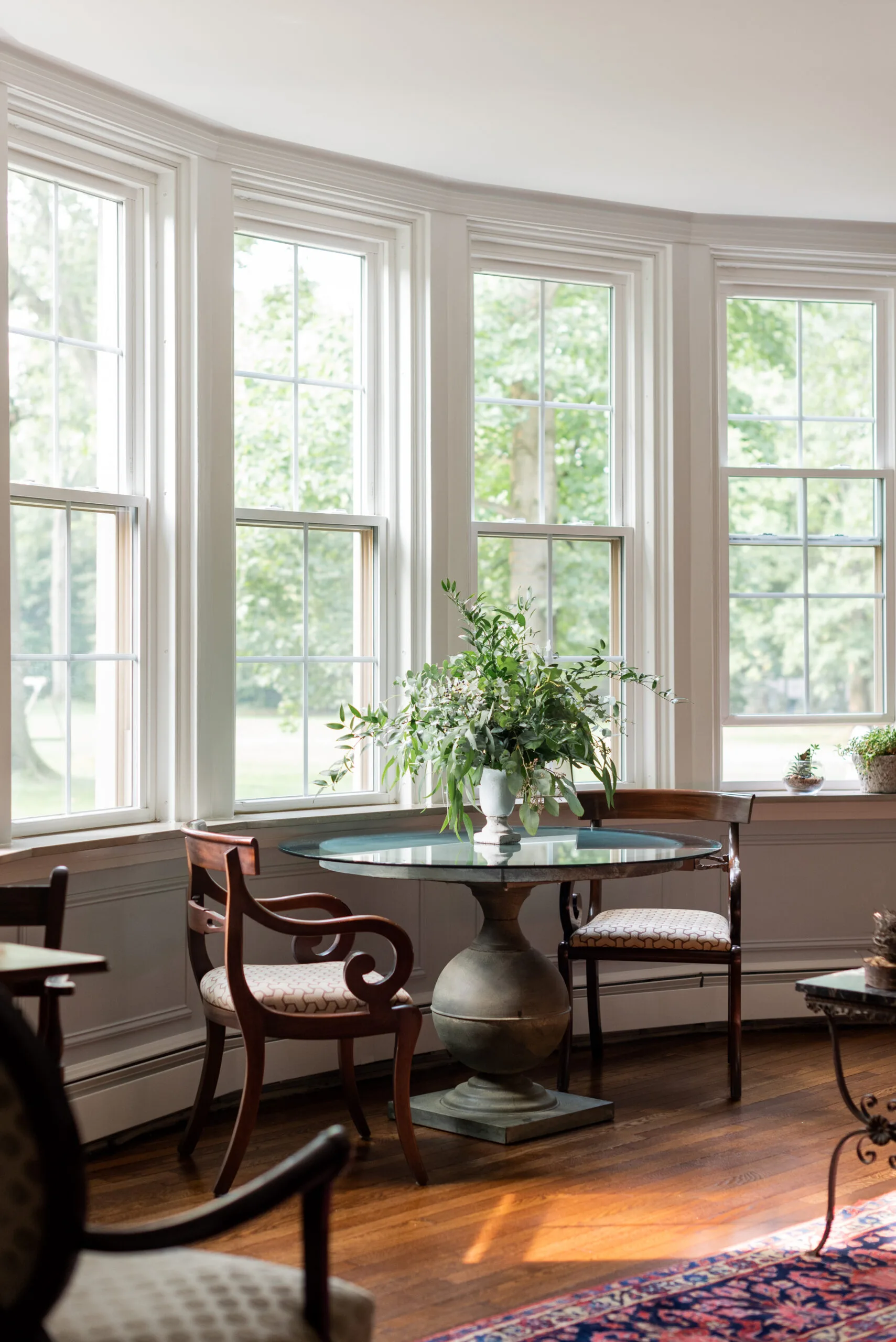 formal living room with curved windows