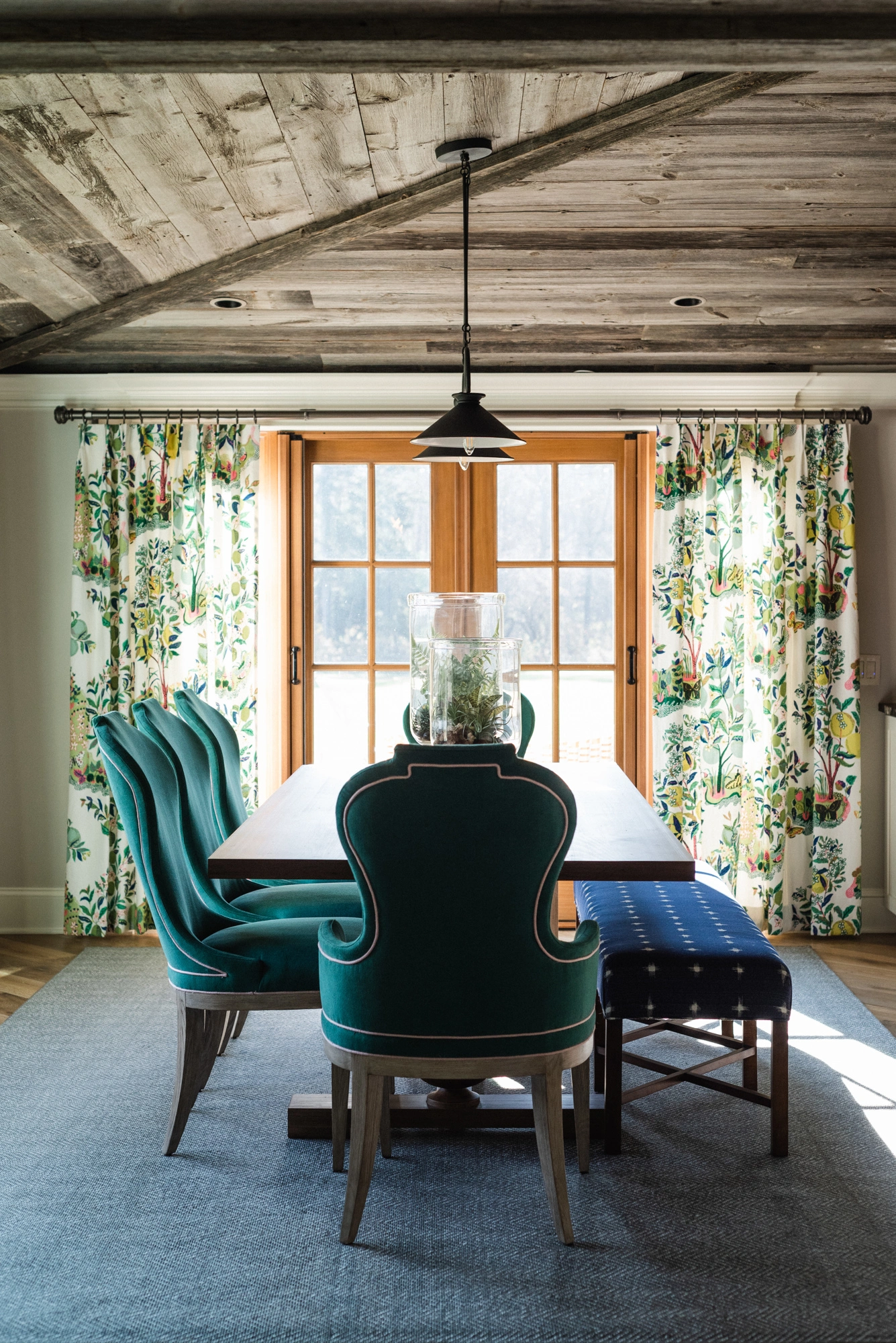 dining room with green upholstered chairs