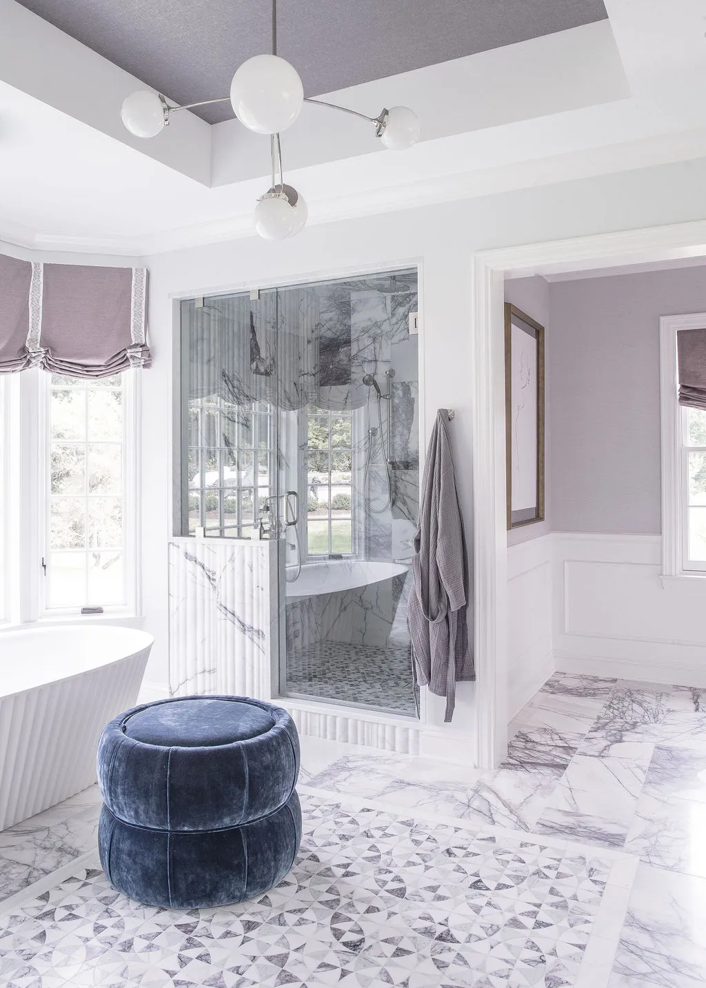 Bathroom with blue ottoman and purple accents
