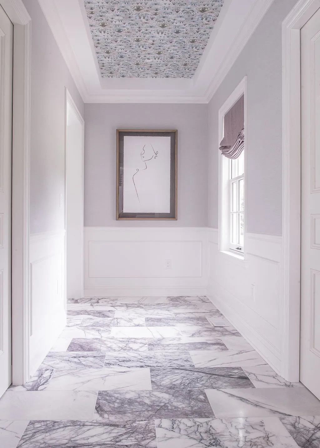 Entrance to bathroom with purple accents