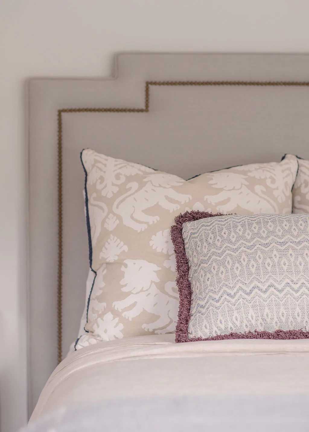 Upholstered headboard and custom pillows