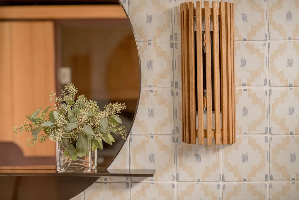 Pool house bathroom sconces and shelf
