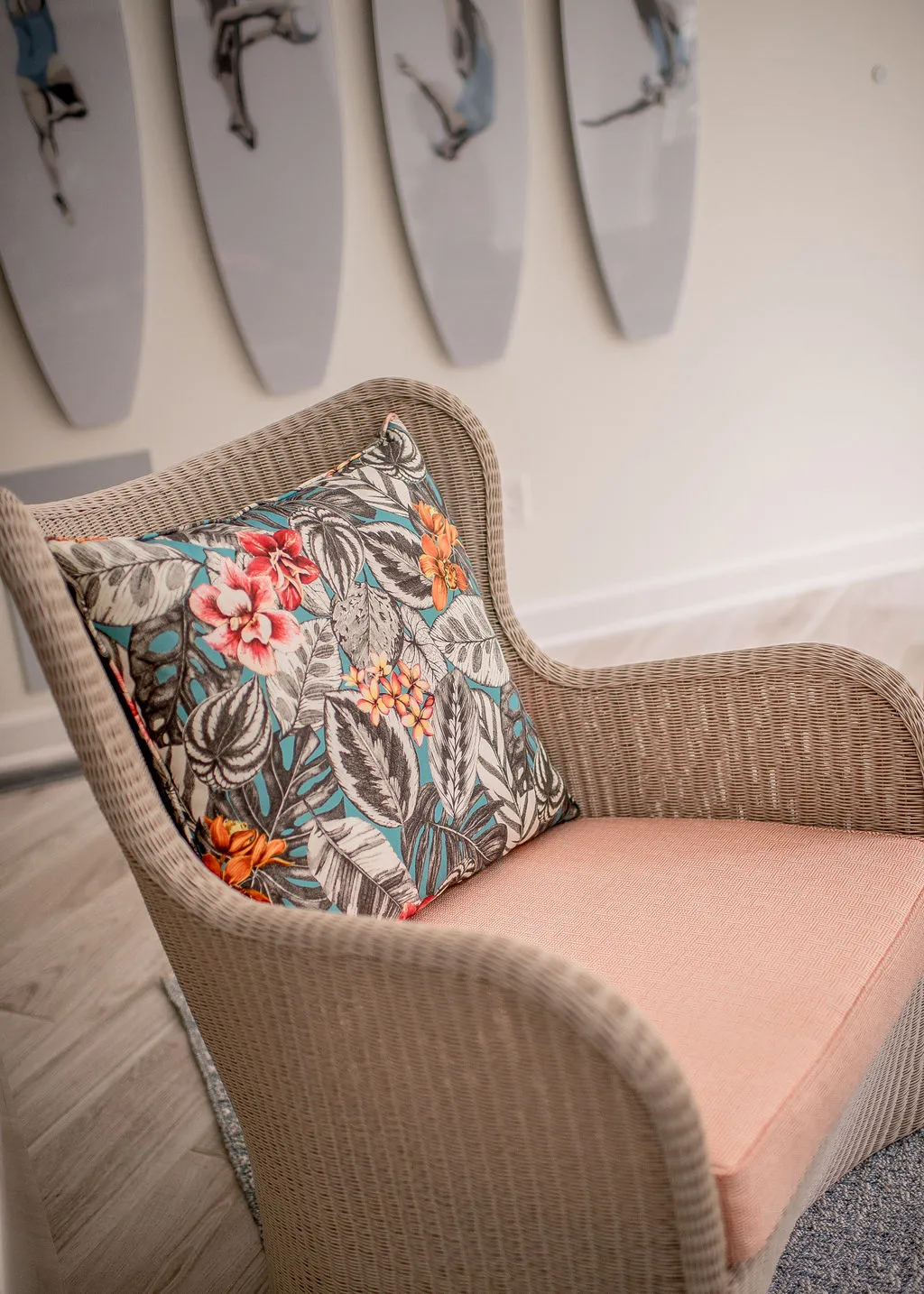 Wicker look chair with colorful pillow and cushion