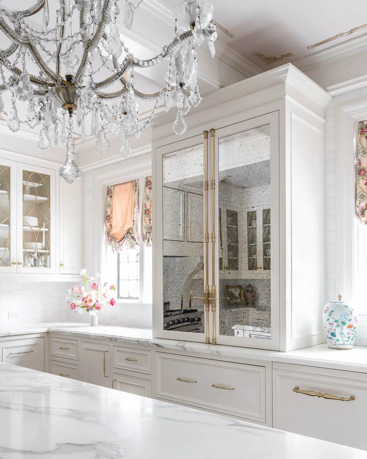 antiqued glass panels on white kitchen cabinets