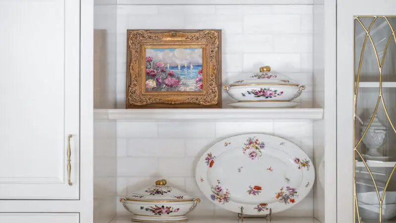 porcelain dishes line open shelving