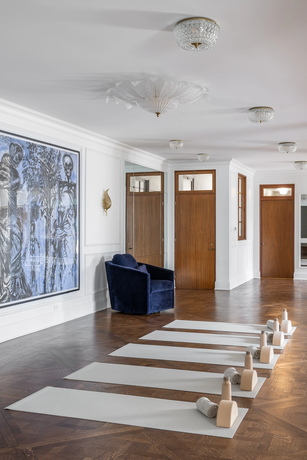 image of Traditional Home Gym, with yoga mats laid out in front of modern artwork, classic architecture