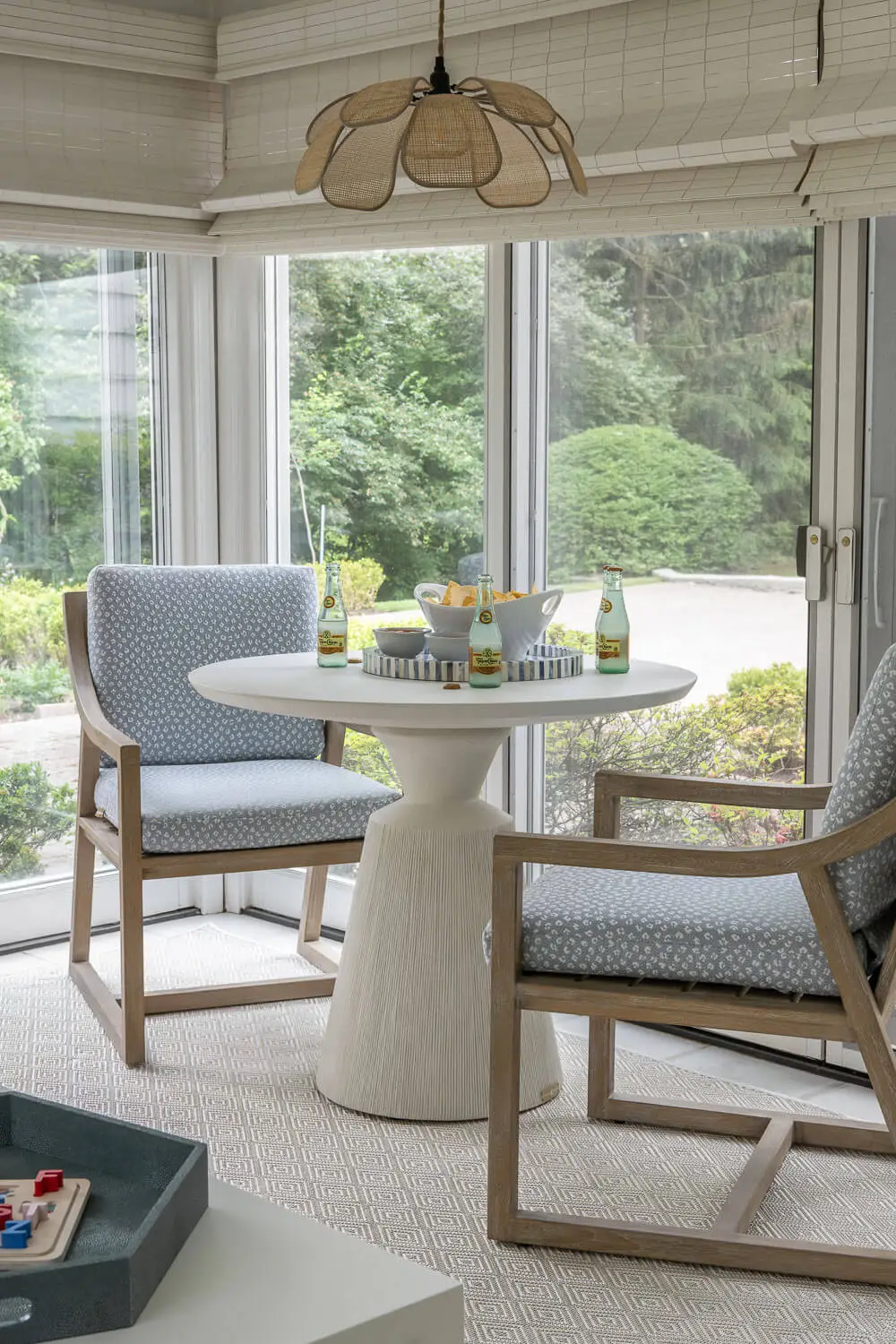 sunroom game table with woven light fixture