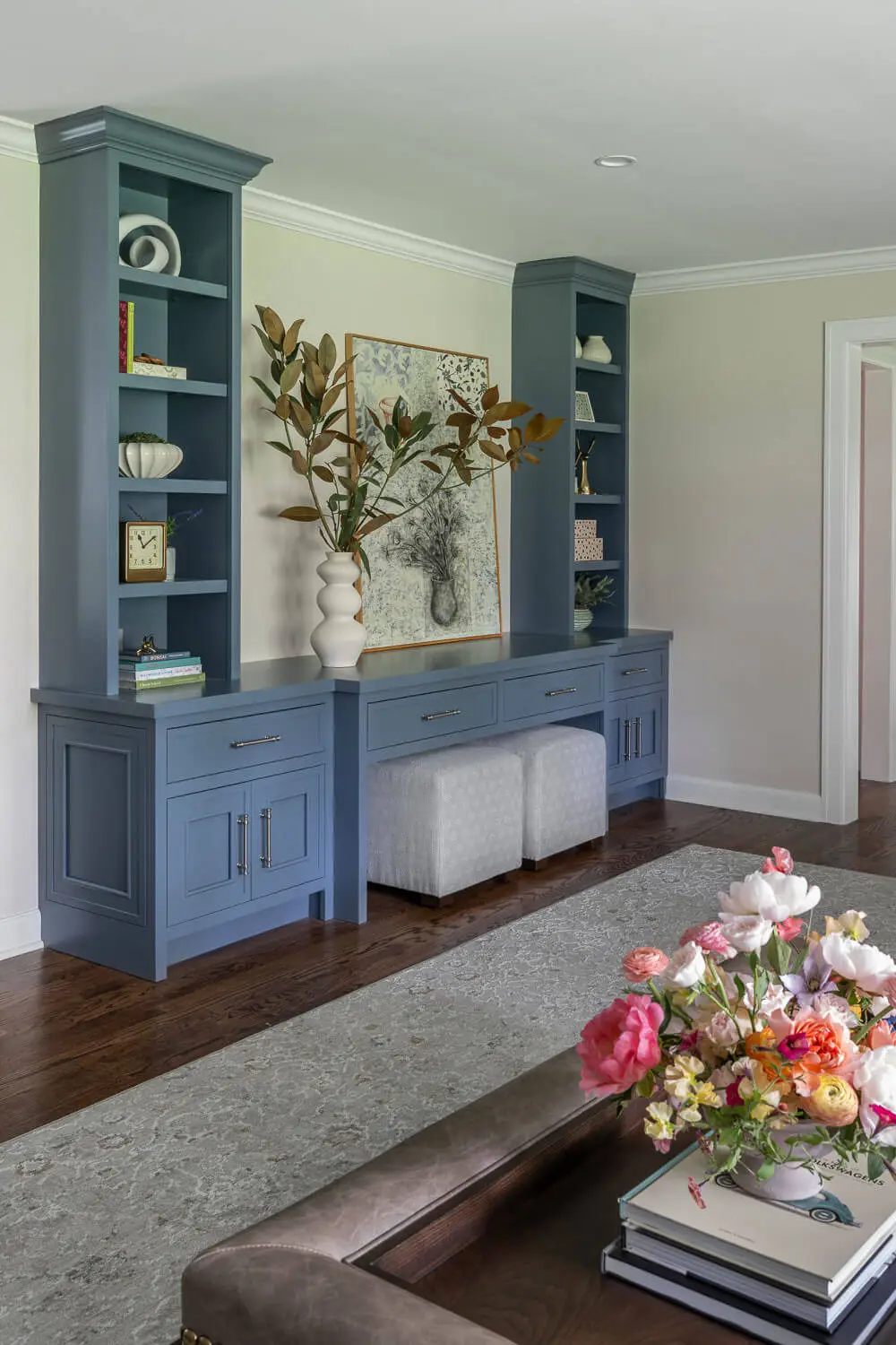 living room with blue custom cabinetry