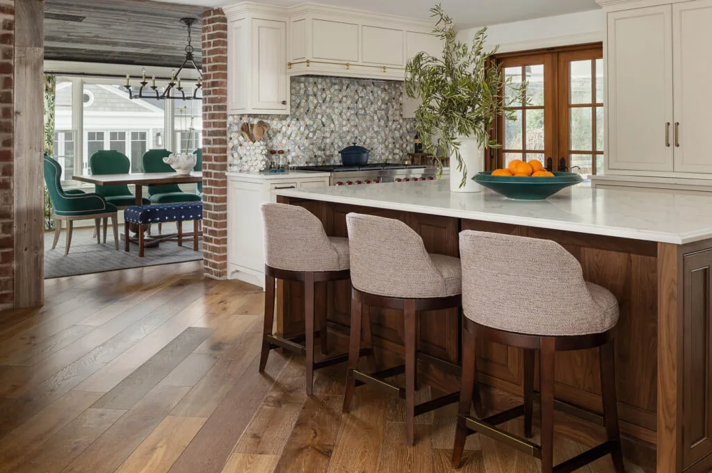 modern upholstered bar stools at white marble top island