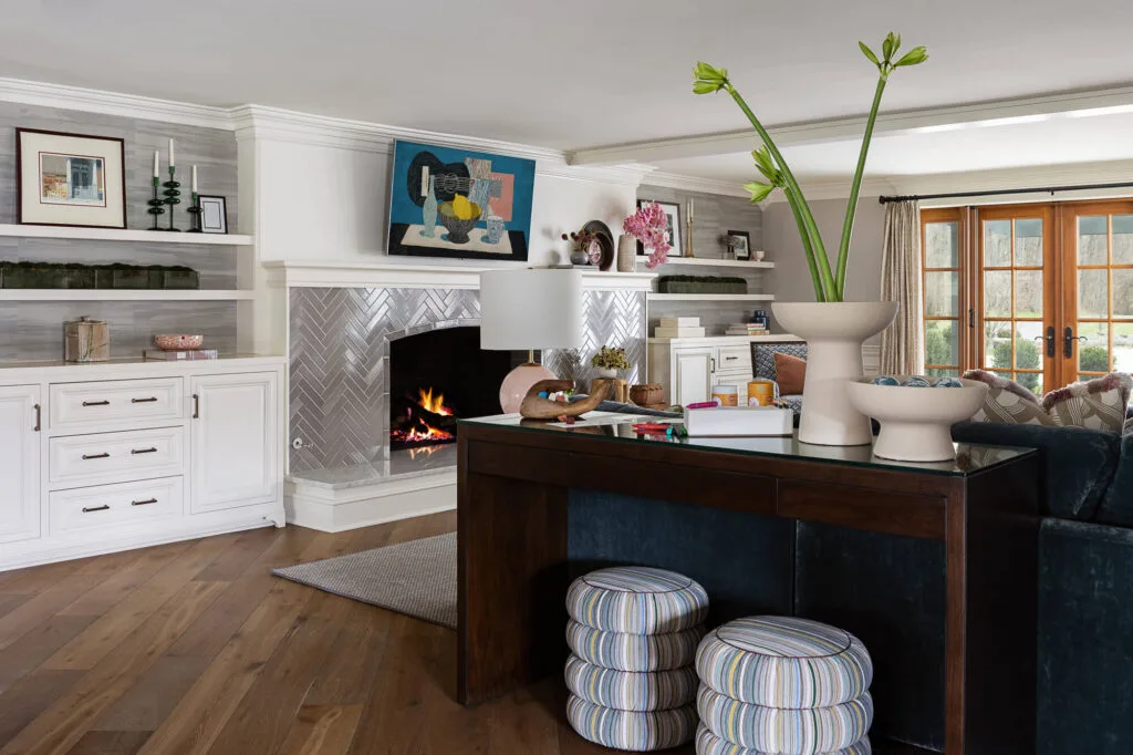 fireplace crackling in a bright and colorful family living room
