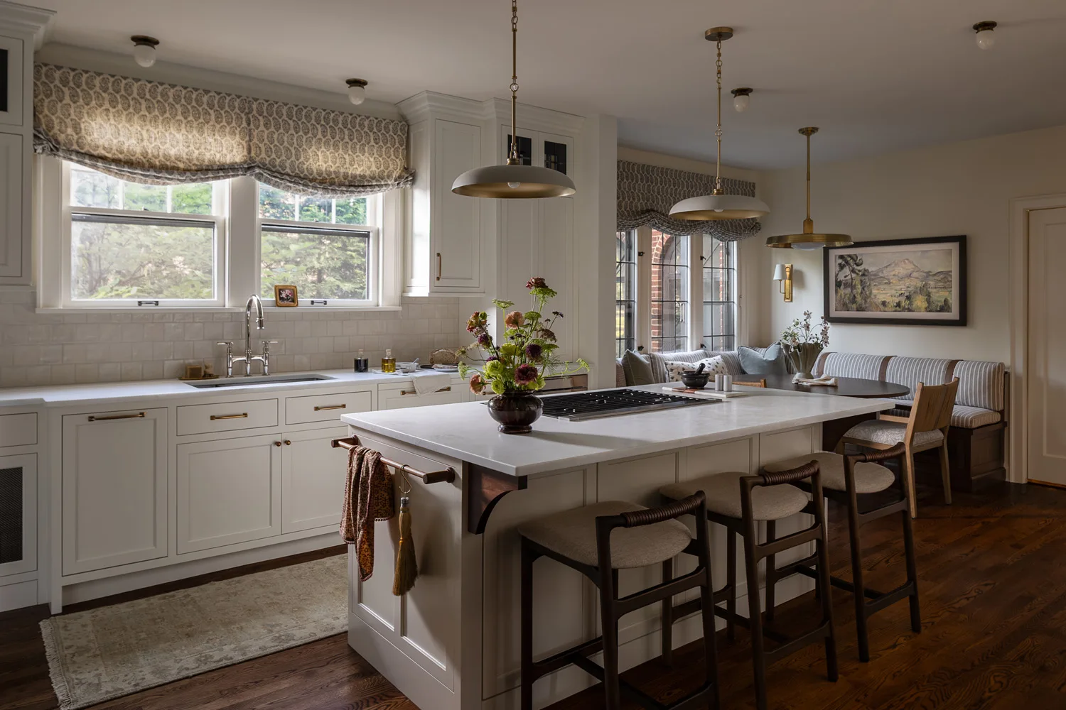 kitchen island with three bar stools