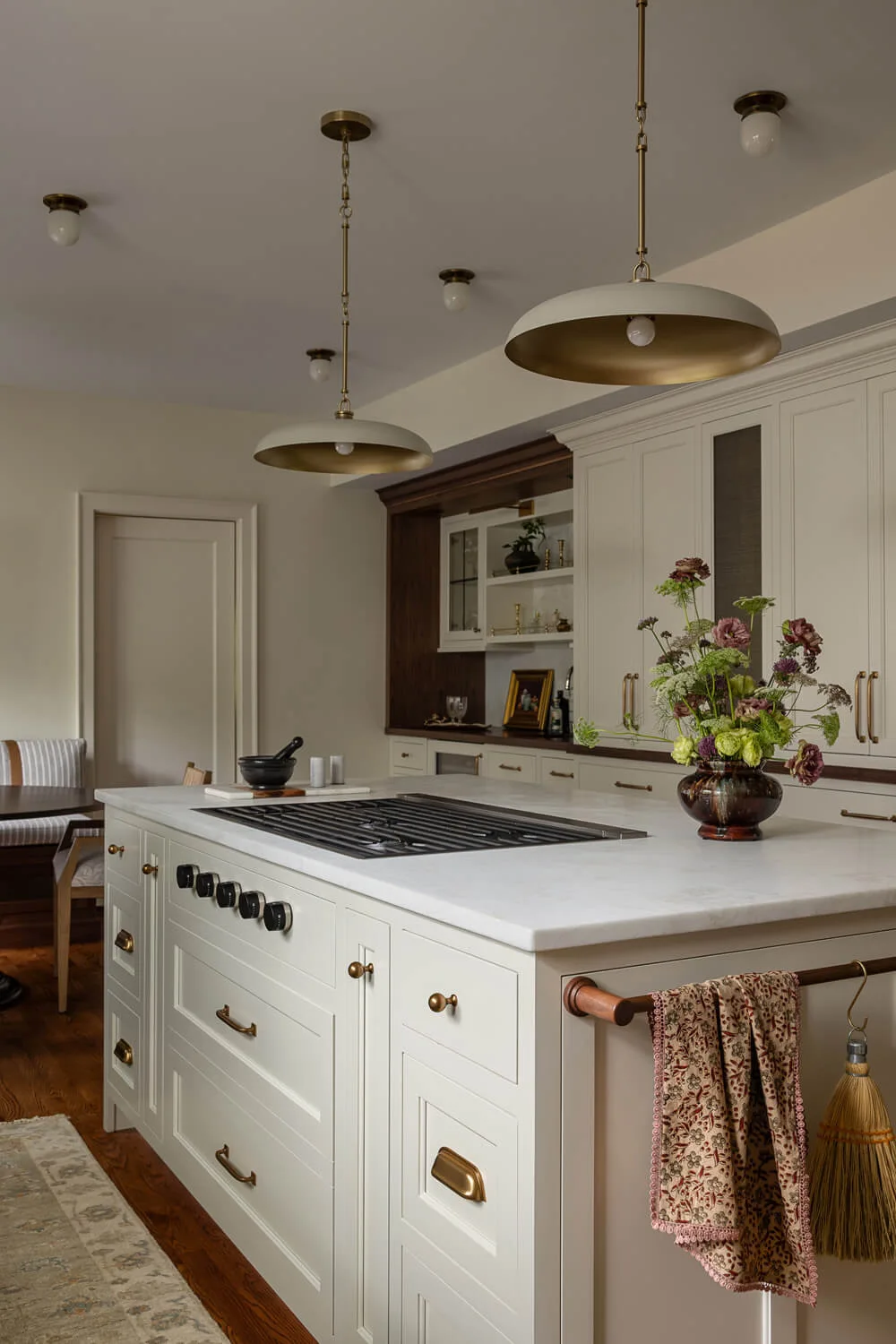white kitchen island with double pendant lights