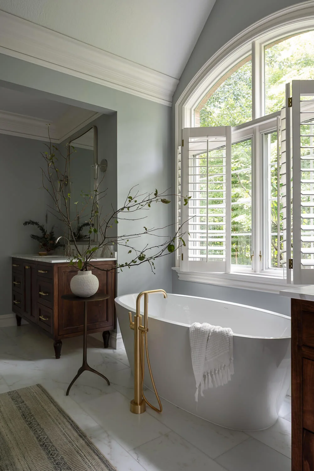 large windows in bathroom with tall ceilings