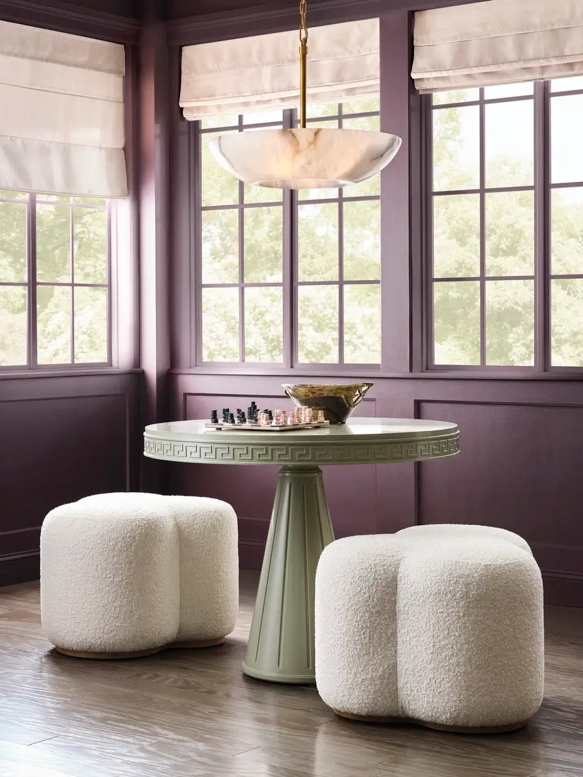 Round light green game table with ottoman seats